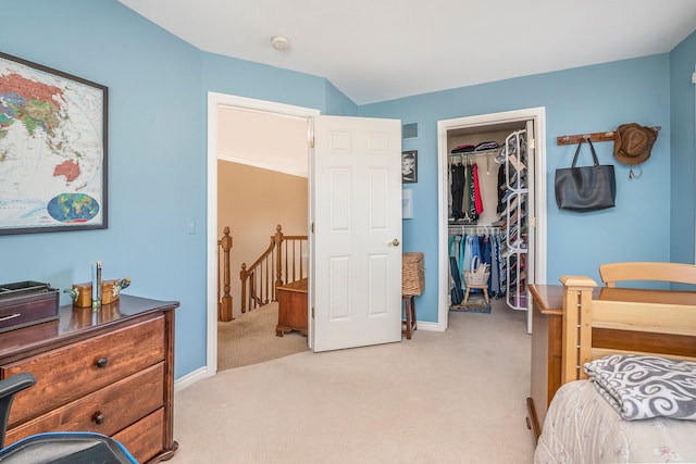 1615 Royal Birkdale Dr, Oxford, MI 48371 - bedroom featuring a closet, visible vents, baseboards, light carpet, and a walk in closet
