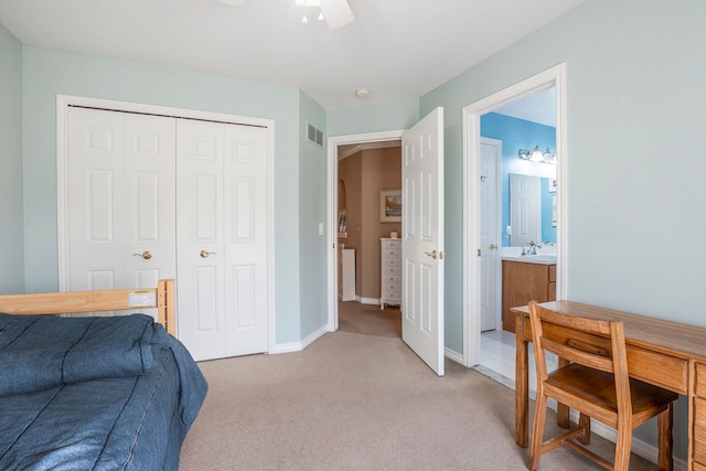 1615 Royal Birkdale Dr, Oxford, MI 48371 - bedroom with a closet, visible vents, baseboards, a sink, and light colored carpet