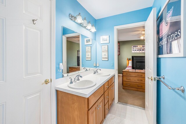 1615 Royal Birkdale Dr, Oxford, MI 48371 - bathroom featuring double vanity, a sink, connected bathroom, and ceiling fan