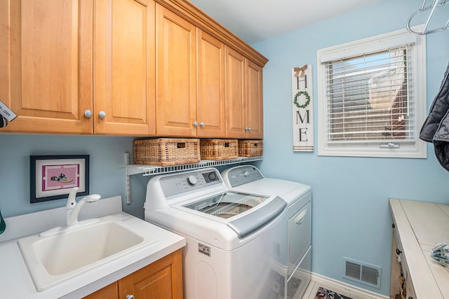 1615 Royal Birkdale Dr, Oxford, MI 48371 - washroom with independent washer and dryer, a sink, cabinet space, and visible vents