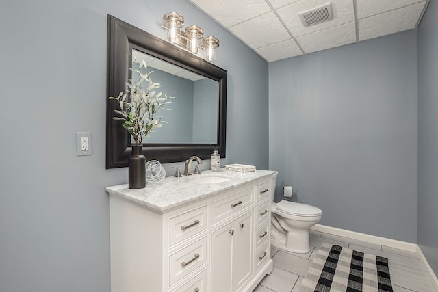 1615 Royal Birkdale Dr, Oxford, MI 48371 - half bath with tile patterned floors, toilet, vanity, baseboards, and visible vents