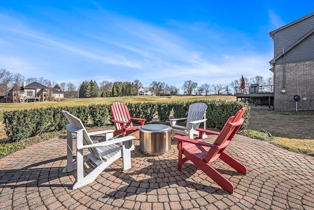 1615 Royal Birkdale Dr, Oxford, MI 48371 - view of patio / terrace with a fire pit, a deck, and a rural view