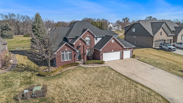 1615 Royal Birkdale Dr, Oxford, MI 48371 - traditional-style home featuring driveway, brick siding, a garage, and a front yard