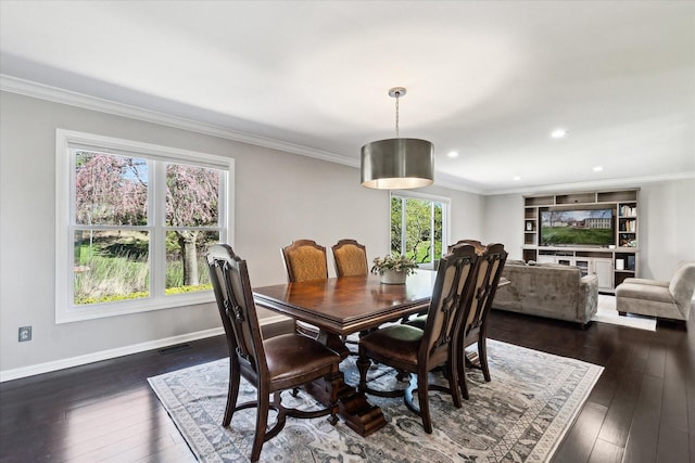 dining area with crown molding, baseboards, dark wood finished floors, and visible vents