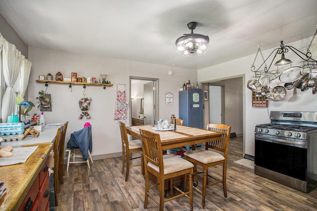 771 Q Dr S, Fulton, MI 49052 - dining room with a chandelier, dark wood-style floors, and baseboards