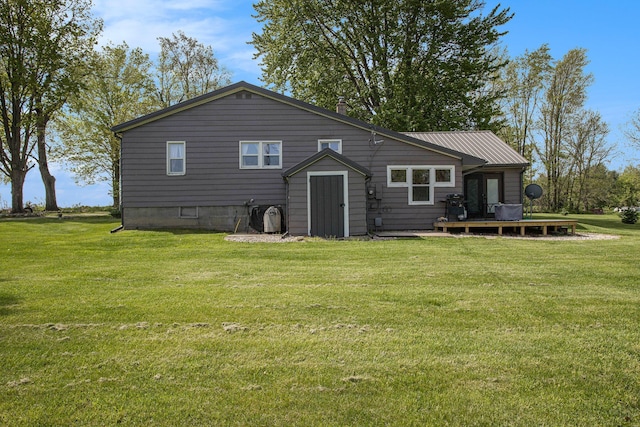 771 Q Dr S, Fulton, MI 49052 - back of house featuring a wooden deck and a yard