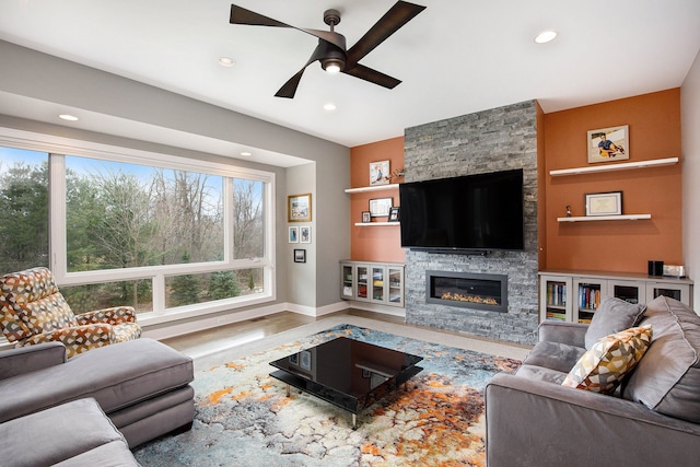 1686 Traceky, Rochester Hills, MI 48306 - living room with a ceiling fan, a fireplace, recessed lighting, baseboards, and wood finished floors