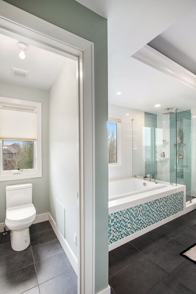 1686 Traceky, Rochester Hills, MI 48306 - bathroom with a stall shower, a bath, toilet, tile patterned floors, and baseboards