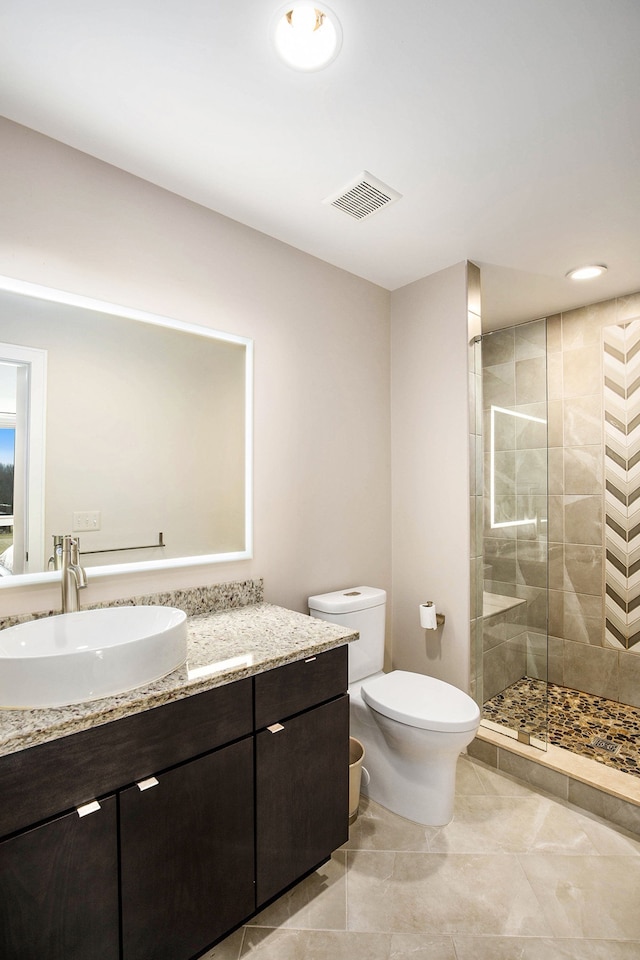 1686 Traceky, Rochester Hills, MI 48306 - full bathroom featuring a stall shower, toilet, tile patterned flooring, and vanity