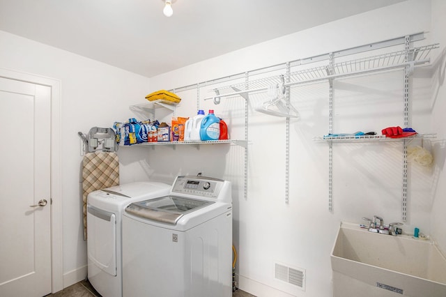 1686 Traceky, Rochester Hills, MI 48306 - clothes washing area featuring separate washer and dryer and baseboards