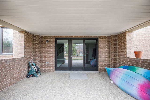1686 Traceky, Rochester Hills, MI 48306 - doorway to property with brick siding and a patio area