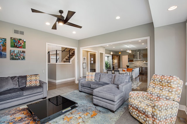 1686 Traceky, Rochester Hills, MI 48306 - living area with wood finished floors, stairs, ceiling fan, recessed lighting, and baseboards