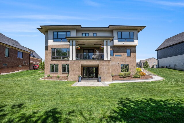 1686 Traceky, Rochester Hills, MI 48306 - back of property with a balcony, brick siding, and a lawn