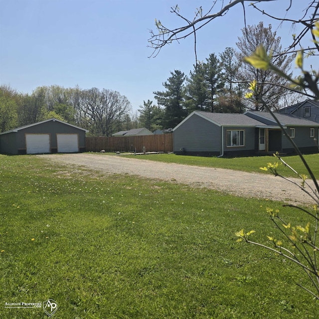 12142 Davison Rd, Davison, MI 48423 - view of yard featuring a detached garage and an outbuilding