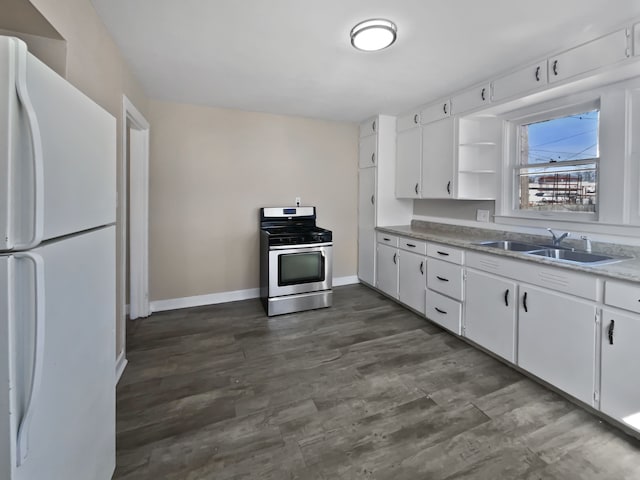 1927 Jarvis Ave, Warren, MI 48091 - kitchen featuring freestanding refrigerator, gas stove, a sink, open shelves, and baseboards