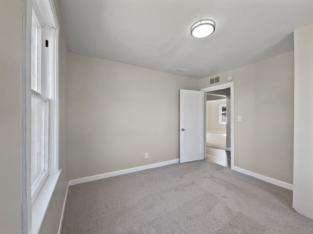 1927 Jarvis Ave, Warren, MI 48091 - unfurnished bedroom featuring baseboards, carpet, and multiple windows