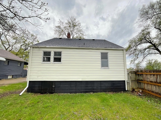 1927 Jarvis Ave, Warren, MI 48091 - back of property with a chimney and roof with shingles