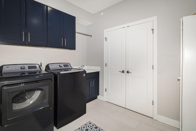 616 Boardwalk Ln Unit 24, Dexter, MI 48130 - washroom featuring baseboards, cabinet space, a sink, and washer and clothes dryer