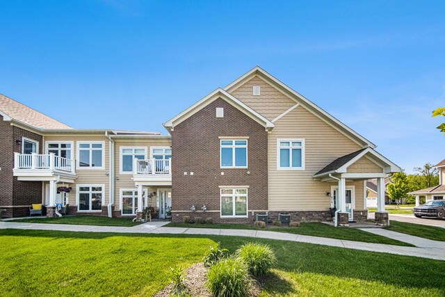 616 Boardwalk Ln, Dexter, MI 48130 - view of front facade with a front lawn and brick siding