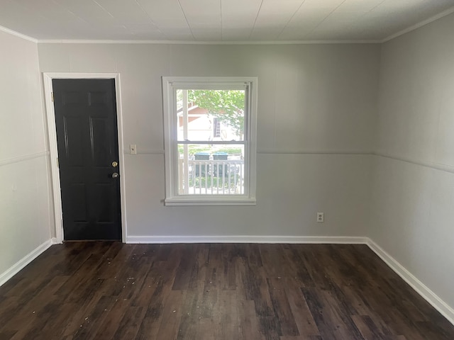 1776 Mcilwrath St, Muskegon, MI 49442 - spare room with ornamental molding, dark wood-style floors, and baseboards