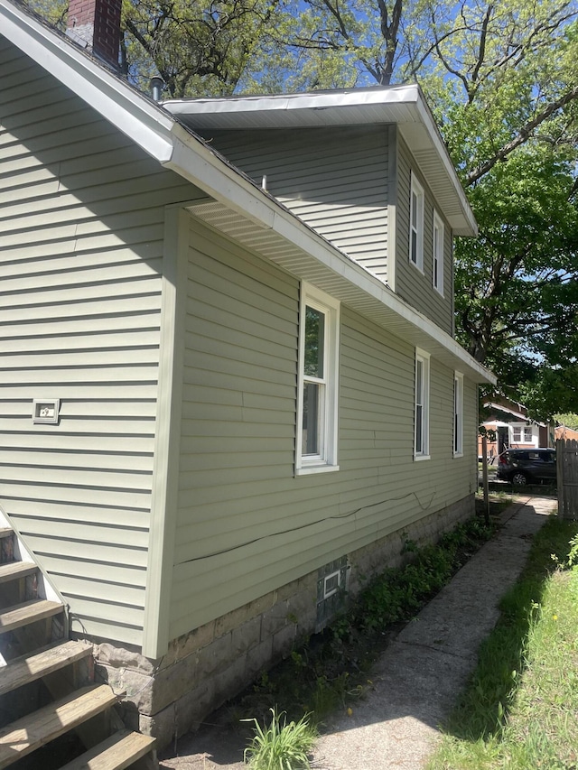 1776 Mcilwrath St, Muskegon, MI 49442 - view of property exterior with a chimney