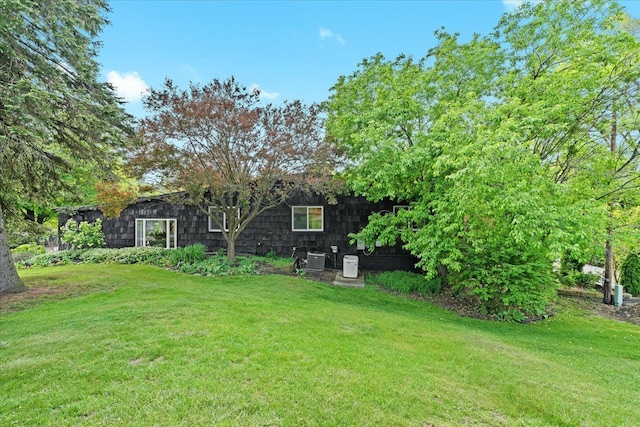2865 Steeple Hill Rd, White Lake, MI 48383 - view of green lawn with central air condition unit