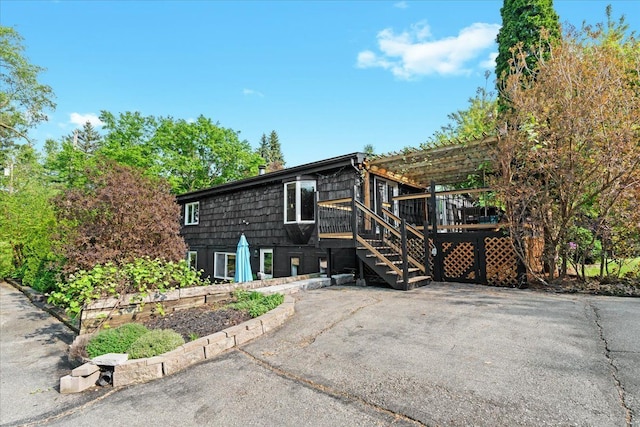 2865 Steeple Hill Rd, White Lake, MI 48383 - view of side of property featuring a wooden deck, stairs, and a pergola