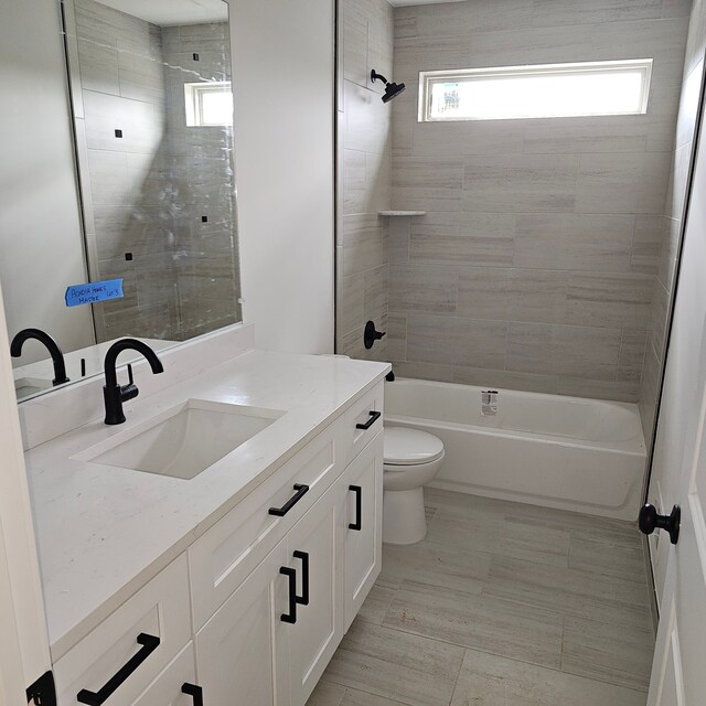 55834 Stewart Dr, Macomb, MI 48042 - bathroom with vanity, toilet, and bathtub / shower combination