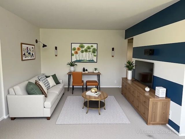 living area with baseboards and light colored carpet