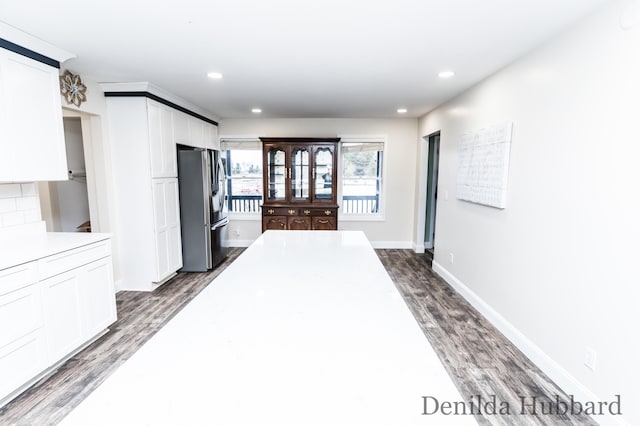 11724 N Satterlee Rd, Lakeview, MI 48850 - kitchen with freestanding refrigerator, white cabinets, dark wood-type flooring, light countertops, and recessed lighting