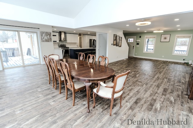 11724 N Satterlee Rd, Lakeview, MI 48850 - dining area with wood finished floors, vaulted ceiling, baseboards, and recessed lighting