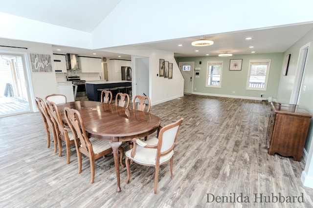 11724 N Satterlee Rd, Lakeview, MI 48850 - dining area featuring light wood finished floors, recessed lighting, lofted ceiling, and baseboards
