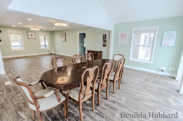 11724 N Satterlee Rd, Lakeview, MI 48850 - dining space with wood finished floors, baseboards, vaulted ceiling, and recessed lighting