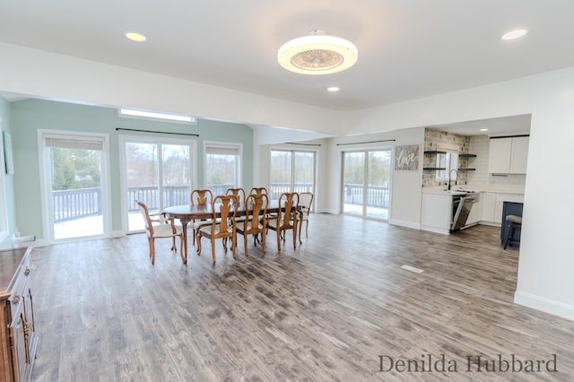 11724 N Satterlee Rd, Lakeview, MI 48850 - dining space with light wood-type flooring, recessed lighting, and baseboards