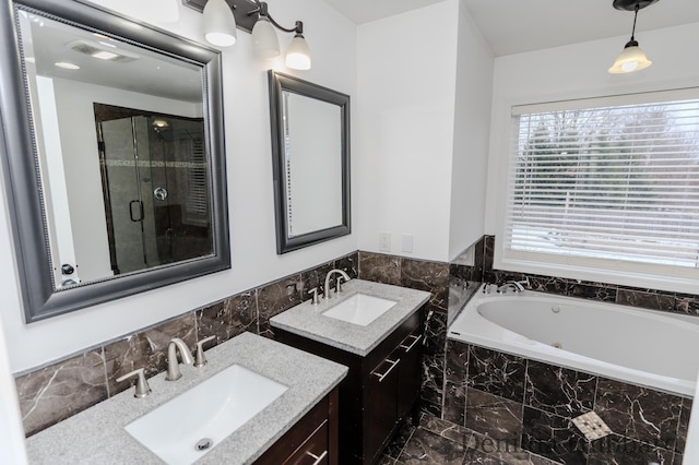 11724 N Satterlee Rd, Lakeview, MI 48850 - bathroom featuring a whirlpool tub, a stall shower, two vanities, and marble finish floors