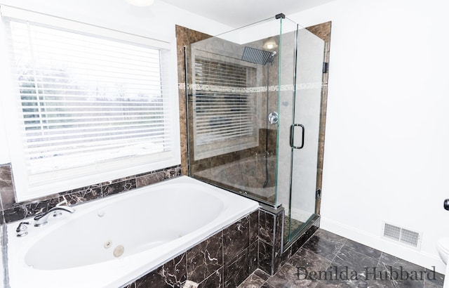 11724 N Satterlee Rd, Lakeview, MI 48850 - full bath featuring a jetted tub, a stall shower, baseboards, marble look tiles, and toilet