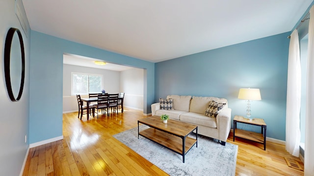 1420 Northbrook Dr, Ann Arbor, MI 48103 - living room featuring visible vents, baseboards, and light wood finished floors