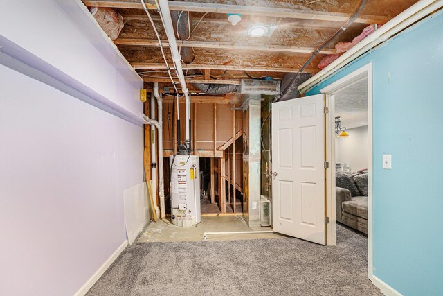 unfinished basement with water heater and baseboards