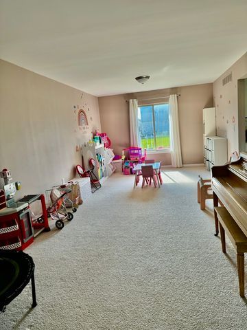 game room featuring carpet flooring and visible vents