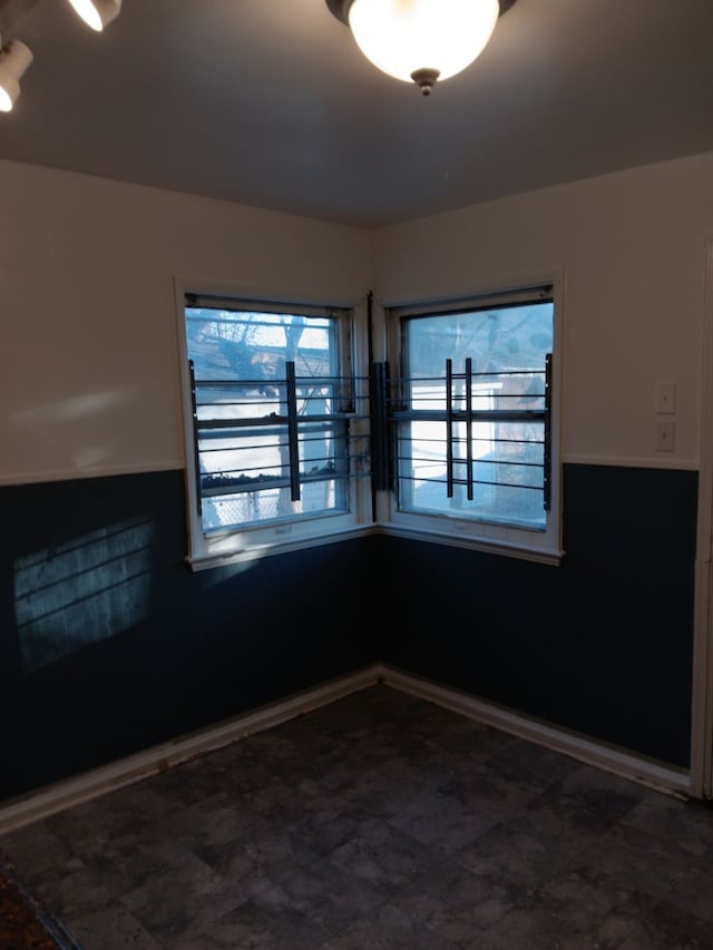 19726 Moross Rd, Detroit, MI 48224 - empty room with baseboards and a wealth of natural light
