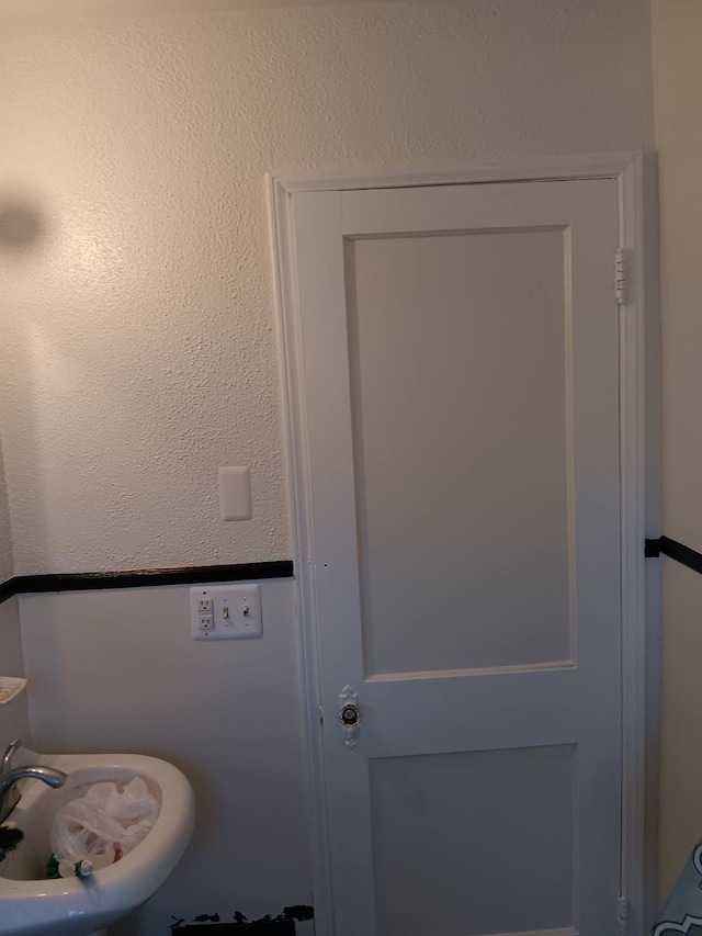 19726 Moross Rd, Detroit, MI 48224 - room details with a sink and a textured wall