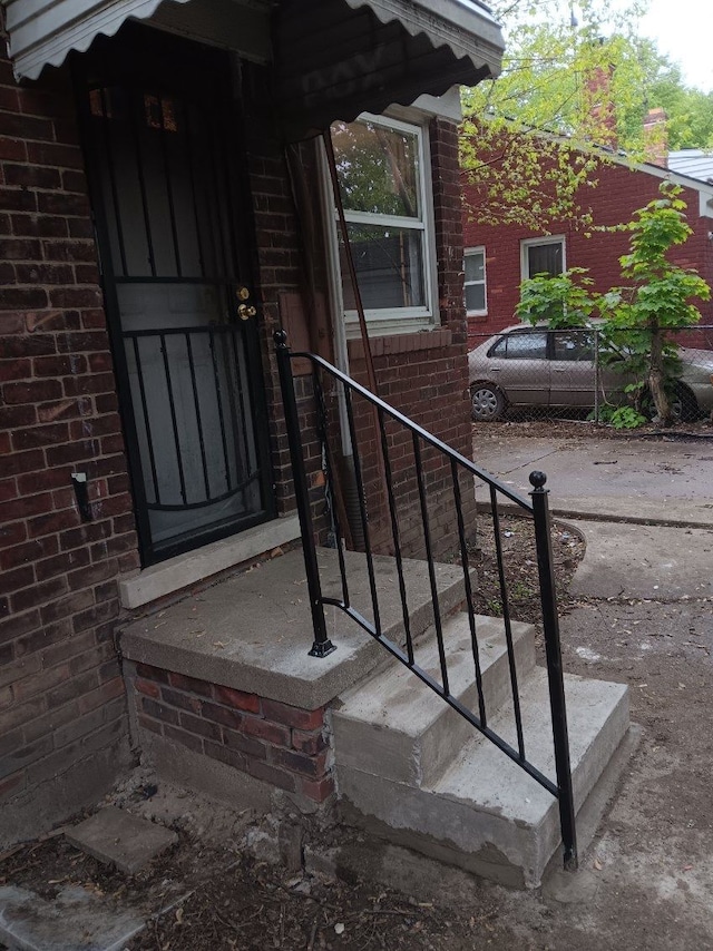 19726 Moross Rd, Detroit, MI 48224 - property entrance featuring brick siding