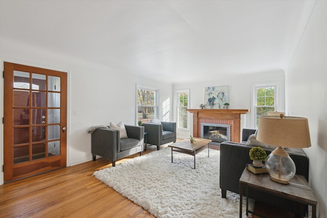 21124 Thorofare Rd, Grosse Ile, MI 48138 - living room with a brick fireplace and light wood-style flooring