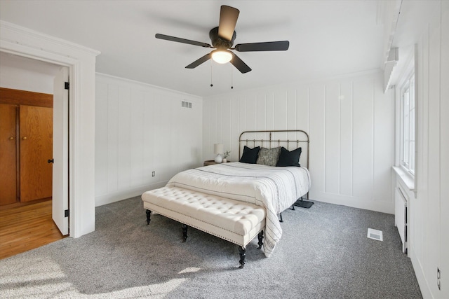 21124 Thorofare Rd, Grosse Ile, MI 48138 - bedroom featuring visible vents, carpet flooring, and a decorative wall