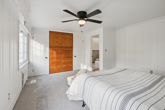 21124 Thorofare Rd, Grosse Ile, MI 48138 - bedroom featuring visible vents, carpet, ceiling fan, and crown molding