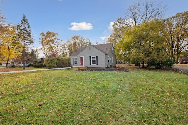 21124 Thorofare Rd, Grosse Ile, MI 48138 - view of home's exterior with a lawn and central air condition unit