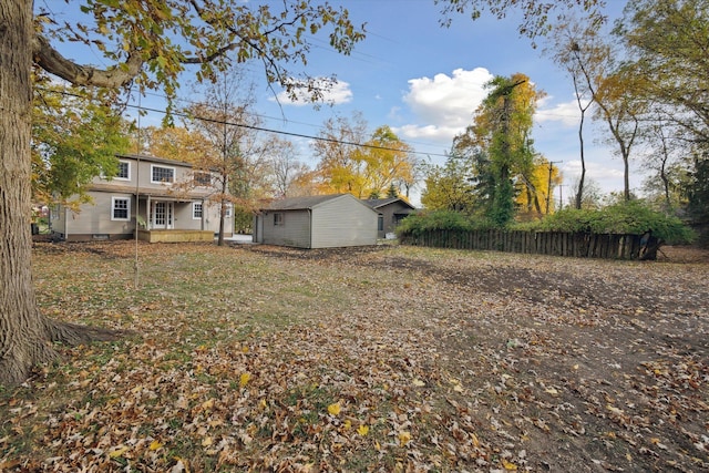 21124 Thorofare Rd, Grosse Ile, MI 48138 - view of yard featuring an outdoor structure and fence