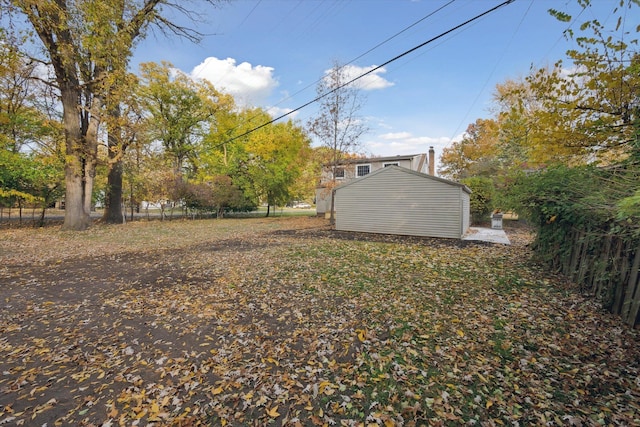 21124 Thorofare Rd, Grosse Ile, MI 48138 - view of yard featuring an outbuilding, a shed, and fence