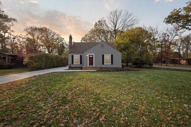 21124 Thorofare Rd, Grosse Ile, MI 48138 - bungalow with a lawn and a chimney