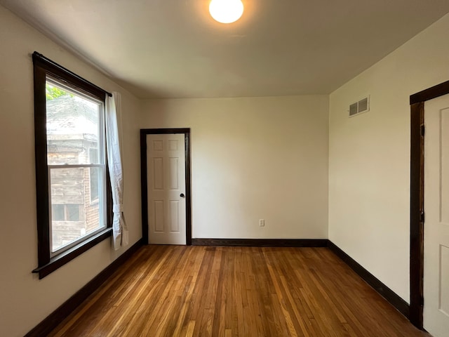 2563 Canton St, Detroit, MI 48207 - empty room featuring dark wood finished floors, baseboards, and visible vents